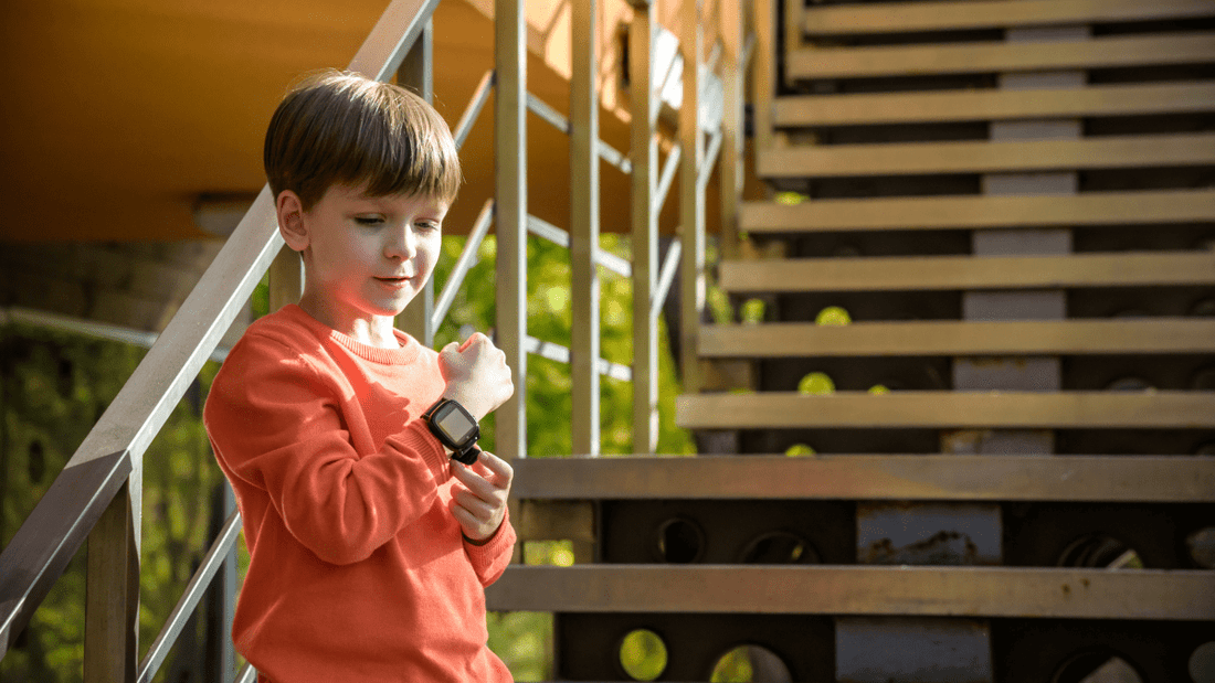 Boy with smartwatch pressing sos-button